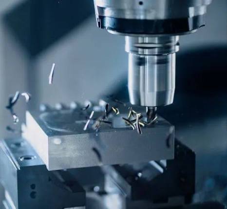 CNC milling head drilling a tool steel block